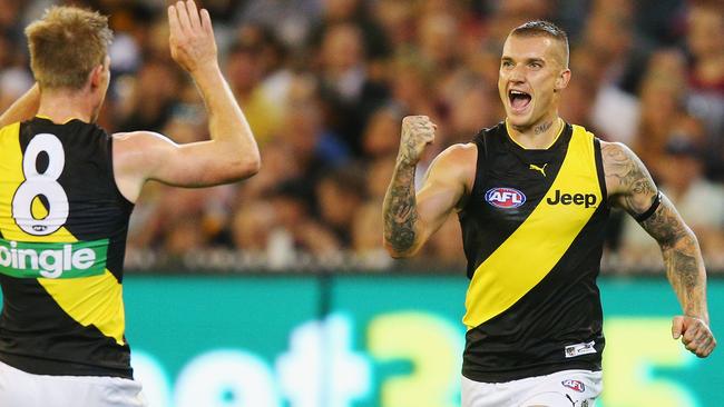 Dustin Martin of the Tigers celebrates a goal with Jack Riewoldt.
