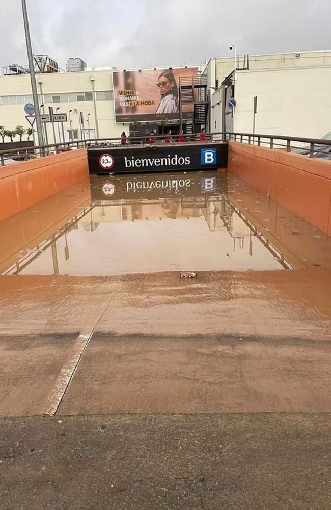 There are fears victims could be trapped in this flooded carpark at Bonaire shopping centre in Spain, with hundreds of cars still inside. Picture: Solarpix