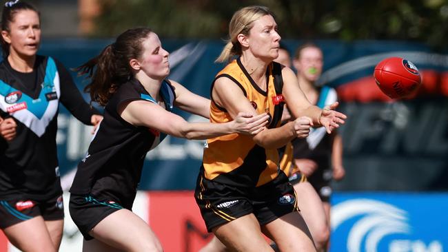 Heidelberg’s Tessa Hankinson gets a handball away under pressure. Picture: Hamish Blair