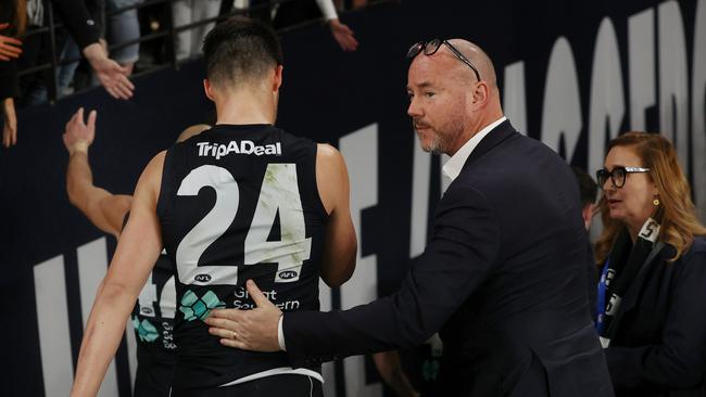 Carlton president Luke Sayers pats Nic Newman on the back as he walks off Marvel Stadium after losing to the Western Bulldogs. Picture: Michael Klein