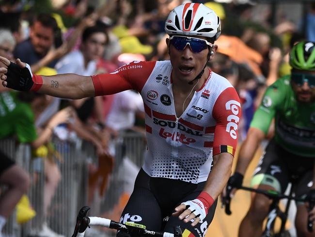 Stage winner Australia's Caleb Ewan (L) celebrates, followed by Slovakia's Peter Sagan, wearing the best sprinter's green jersey, his victory on the podium of the eleventh stage of the 106th edition of the Tour de France cycling race between Albi and Toulouse, in Toulouse on July 17, 2019. (Photo by Anne-Christine POUJOULAT / AFP)