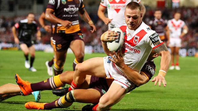 Euan Aitken scores a try for the Dragons.