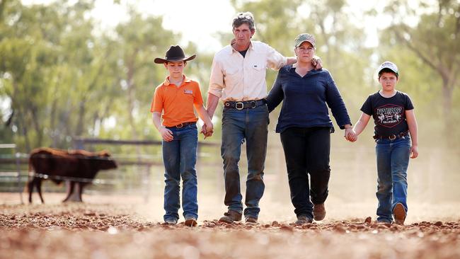 The O'Brien family survey their drought-ravaged farm. From left, Harrison, Justin, Kate and James. Picture: Sam Ruttyn