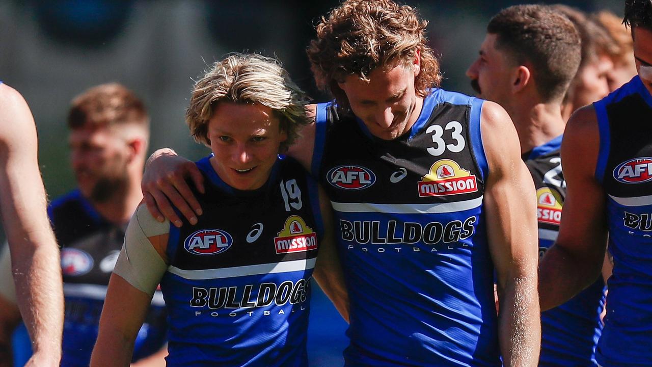 Cody Weightman (left) and Aaron Naughton embrace during Western Bulldogs training in Perth. Picture: Michael Willson / AFL Photos via Getty Images