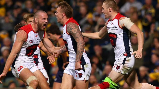 Melbourne players celebrate their win. Picture: Getty Images