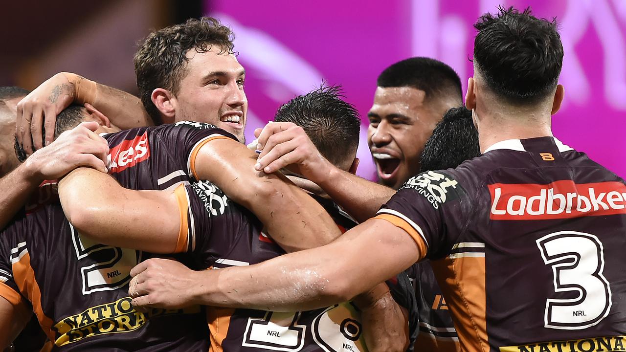 Xavier Coates of the Broncos celebrates with Corey Oates after scoring a try.