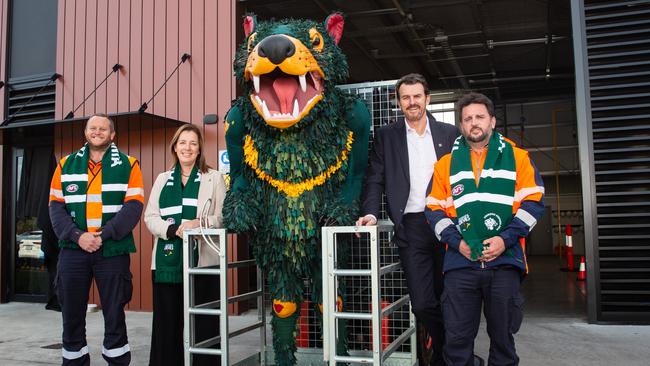 Tasmania Devils Mascot with CEO Brendon Gale (second right). Picture: Linda Higginson