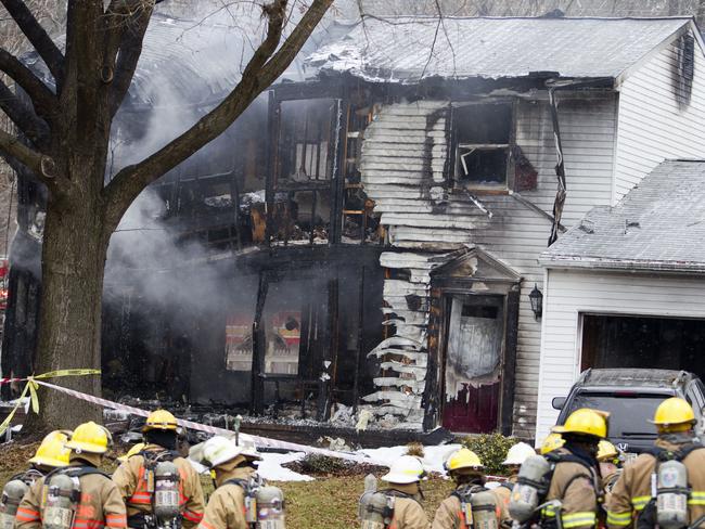 A small, private jet has crashed into a house in Maryland's Montgomery County. (AP Photo/Jose Luis Magana)