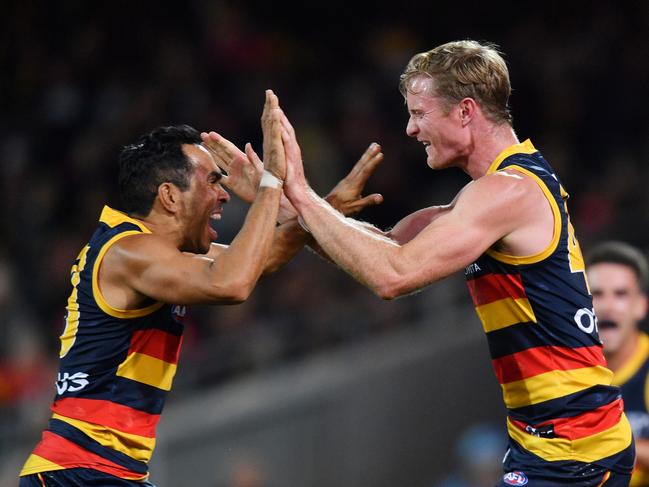 Alex Keath celebrates a goal with Eddie Betts during the Round 7 clash against Fremantle at Adelaide Oval. Picture: AAP Image/David Mariuz