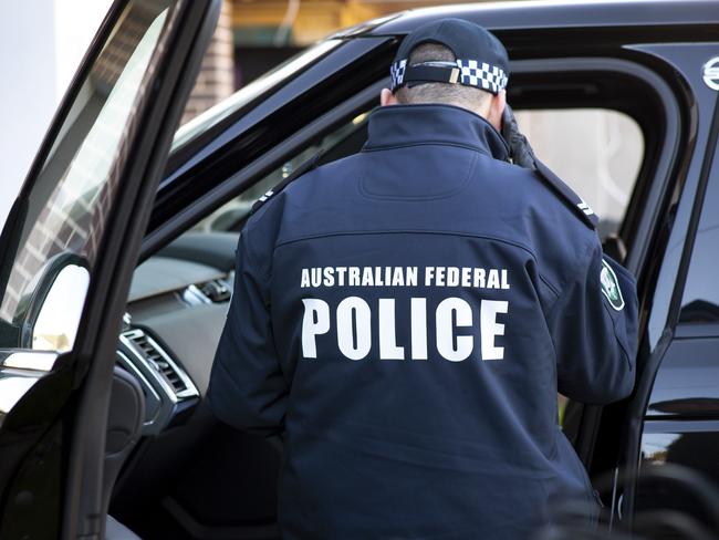 A joint-agency investigation into an elaborate $17 million fraud has resulted in charges against 12 people across the east coast of Australia – including people who have been of long-term interest to transnational and serious organised crime investigators., , Australian Federal Police (AFP) investigators yesterday executed search warrants at 10 locations across Sydney, nine in south-east Queensland and two in the ACT in a coordinated strike against a transnational and serious organised criminal syndicate using labour hire and payroll companies associated with the building and construction industry to defraud the Commonwealth. Picture: AFP