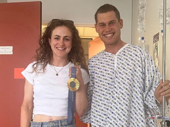 Australian gold medalist Grace Brown visited teammate Luke Plapp in hospital.