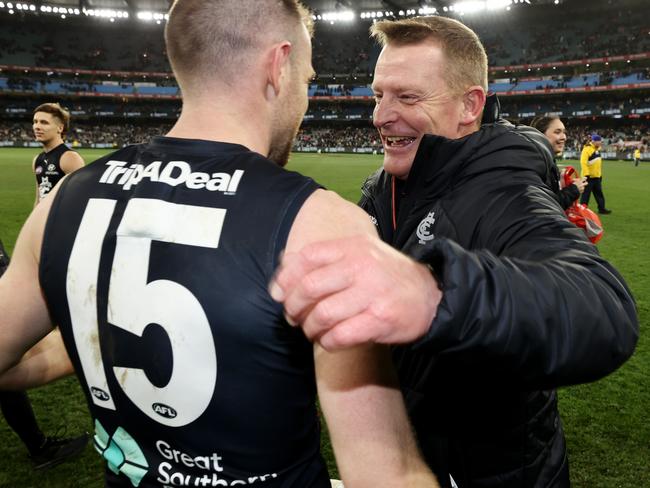 Michael Voss embraces Docherty. Picture: Michael Klein