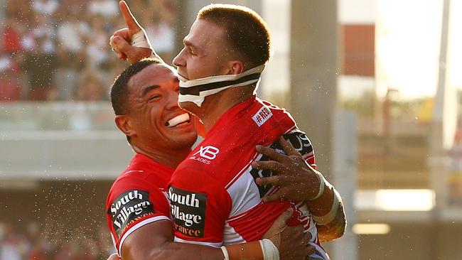 Euan Aitken of the Dragons celebrates scoring a try with Tyson Frizell.