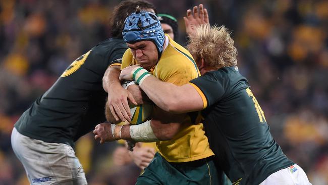 Wallabies player James Horwill (centre) with possession during the Rugby Championship test match between the Australian Wallabies and South African Springboks at Suncorp Stadium in Brisbane Saturday, July 18, 2015. (AAP Image/Dave Hunt) NO ARCHIVING, EDITORIAL USE ONLY