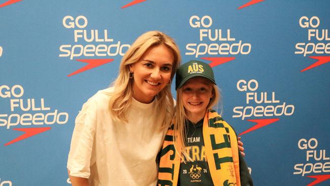 Tassie golden girl Ariarne Titmus makes a splash in Launceston meeting fan Maddie Lange (11) from Hobart. Picture: Stephanie Dalton