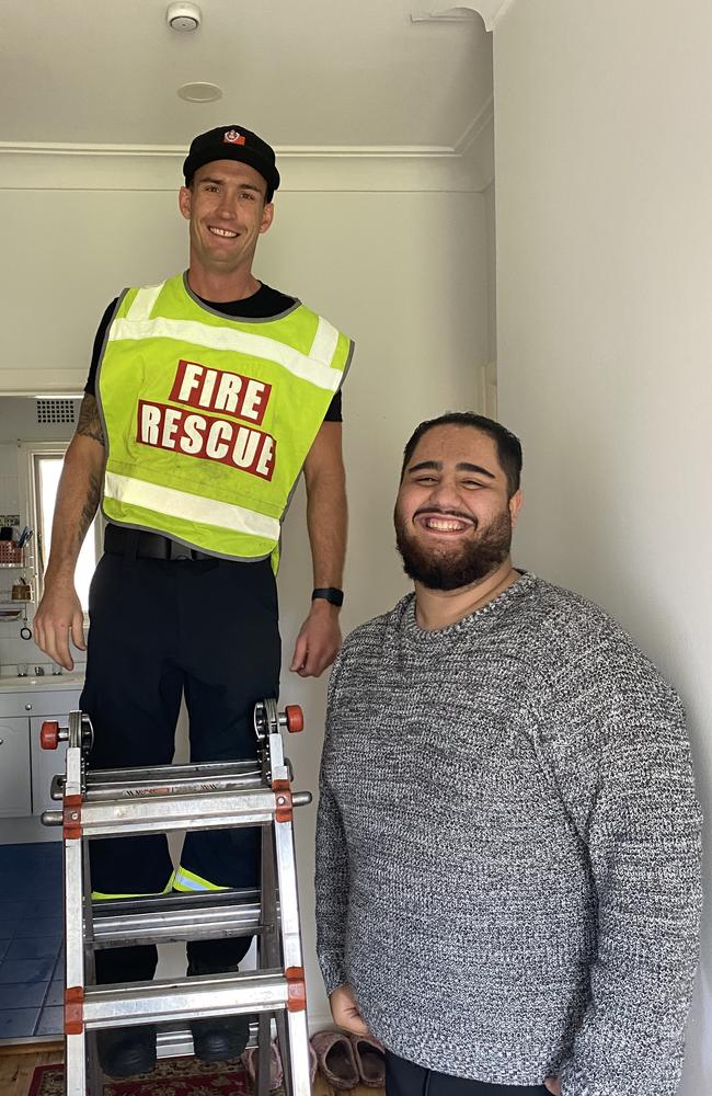 Senior Firefigher from the Liverpool Brigade, Luke Marsden installing free smoke alarms for Liverpool local Daniel Mandawi, 21.