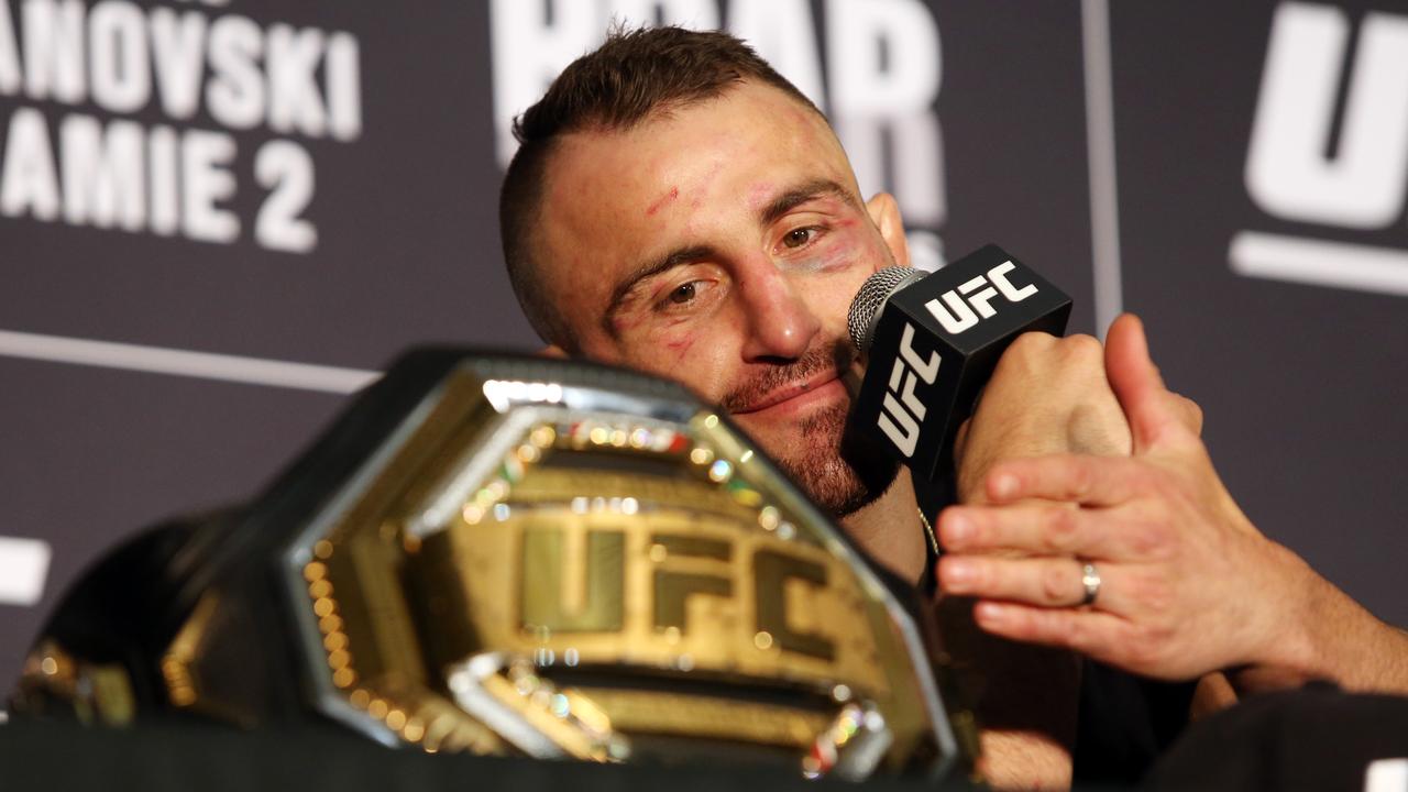 Alex Volkanovski looks at his new title. Picture: Richard Dobson