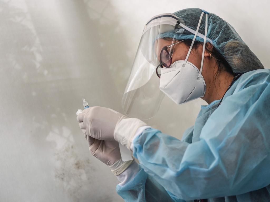 A health worker preparing to give a shot of the Chinese Sinopharm vaccine during a trial. Picture: ERNESTO BENAVIDES / AFP.