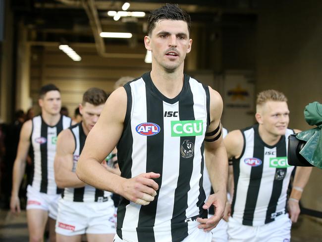 Safe to say, Scott Pendlebury enjoys leading his team onto the footy field. Picture: Michael Klein