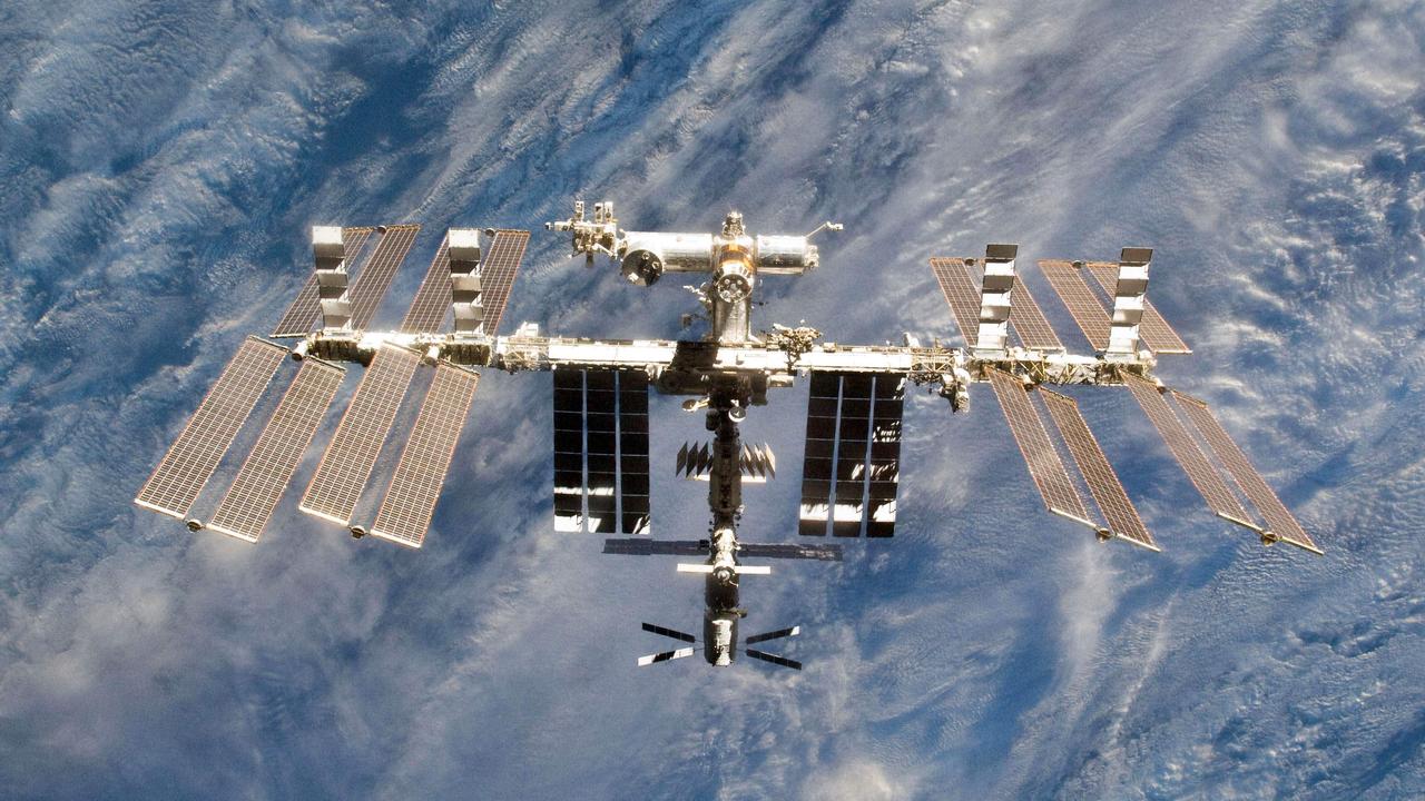The International Space Station currently has seven astronauts on board who were forced to take evasive action after the Russian missile strike destroyed one of its own satellites. The debris cloud has created an international political storm here on Earth. Picture: NASA/AFP