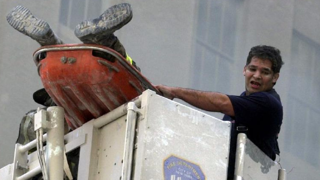 As an injured fireman was being lifted on to a ‘cherry-picker’, Nathan recalls: “All I could see were his feet and one of his mates, screaming for more help.” He later learned the firefighter didn’t survive. Picture: Nathan Edwards