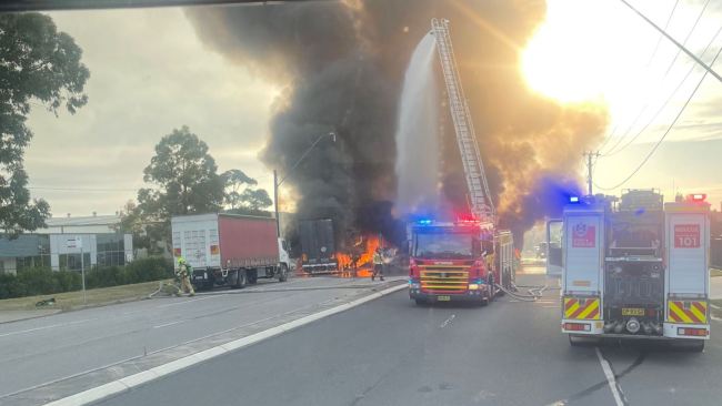 Plumes of smoke are seen at the scene on Thursday morning. Picture: Fire and Rescue NSW