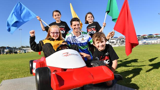 Mini-kart fun at the Adelaide 500 track with Indianah, 7, Tia, 10, driver Nick Percat, Nahla, 7, and Henry, 10. Picture: Keryn Stevens/AAP