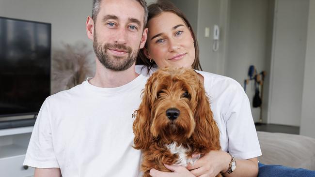 Rory Esler at home in New Farm with partner Olivia and dog George. Picture: Lachie Millard