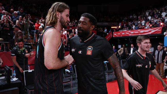 Hawks head coach Justin Tatum celebrate with Sam Froling. Picture: Matt King/Getty Images