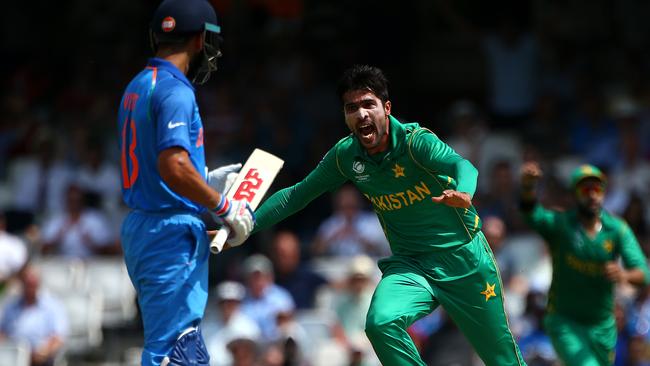 Mohammad Amir celebrates the wicket of Virat Kohli.
