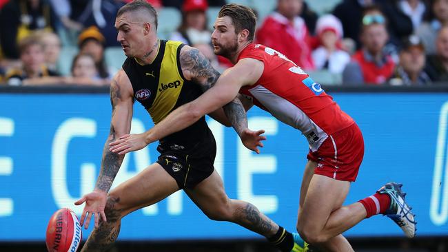 Dustin Martin under pressure from Swan Harry Marsh in Round 13. Picture: Michael Klein