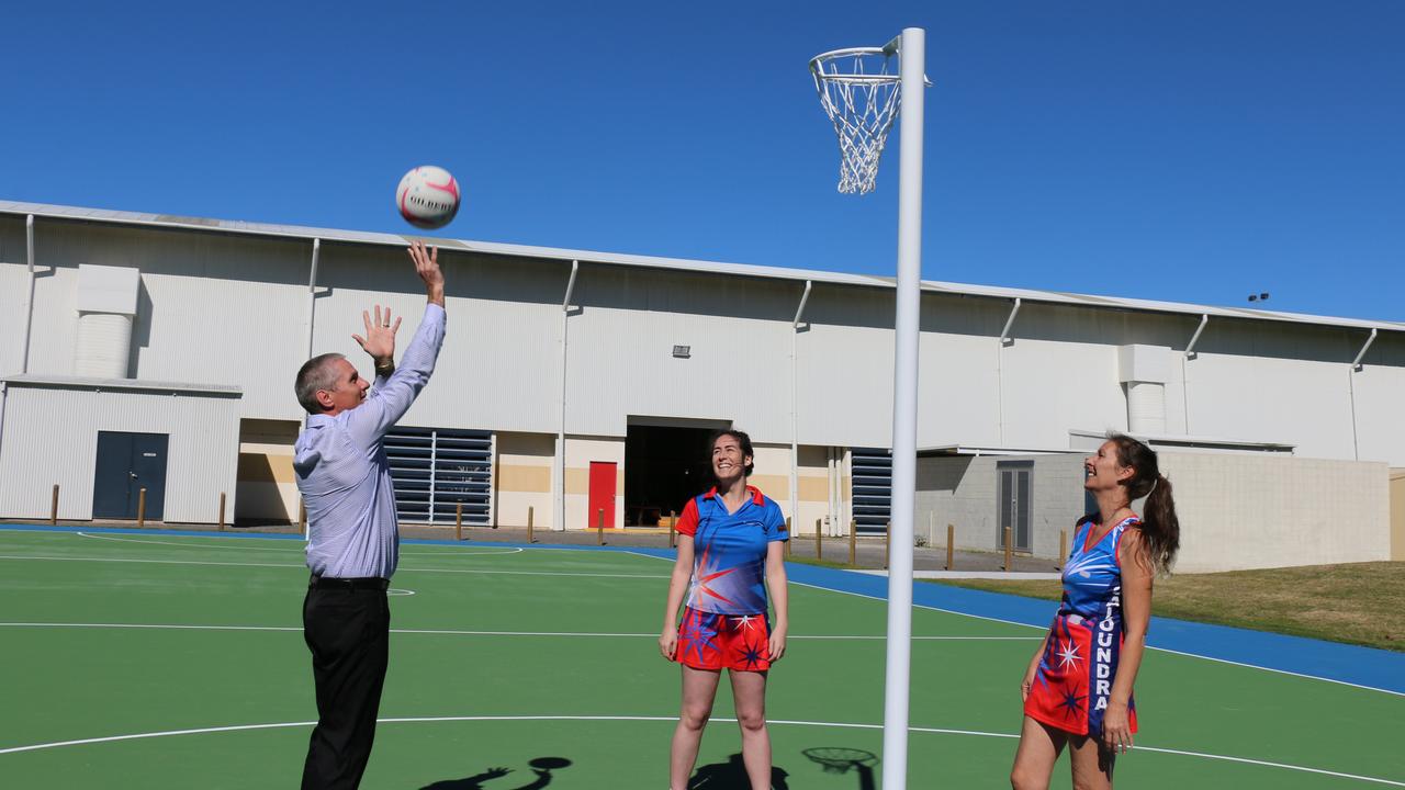 Former Deputy Mayor Tim Dwyer plays on one of the new courts with Caloundra District Netball Association players Rebecca McDonald and Sandy Cameron.