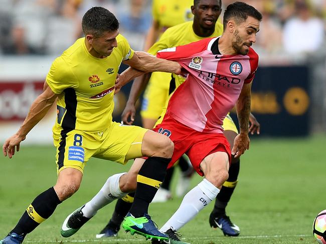 Nick Montgomery of the Mariners competes for possession with Anthony Caceres of City during the round 13 A-League match between the Central Coast Mariners and Melbourne City FC at Central Coast Stadium in Gosford, Saturday, Dec. 31, 2016. (AAP Image/Dan Himbrechts) NO ARCHIVING, EDITORIAL USE ONLY