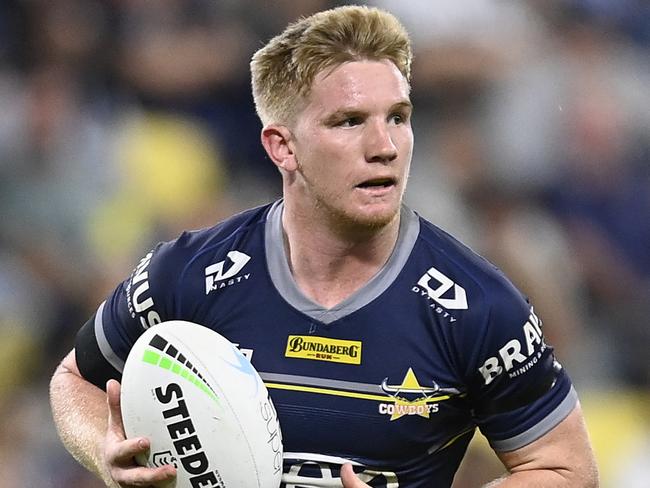 TOWNSVILLE, AUSTRALIA - AUGUST 19:  Tom Dearden of the Cowboys runs the ball during the round 23 NRL match between the North Queensland Cowboys and the New Zealand Warriors at Qld Country Bank Stadium, on August 19, 2022, in Townsville, Australia. (Photo by Ian Hitchcock/Getty Images)