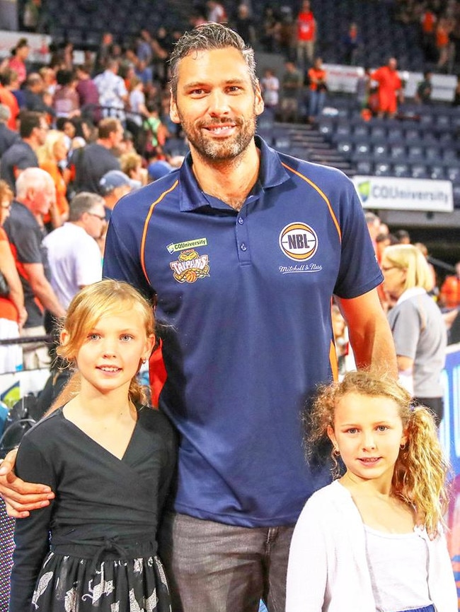 Matt Smith with his daughters at the Cairns Convention Centre before a Taipans game in 2018.