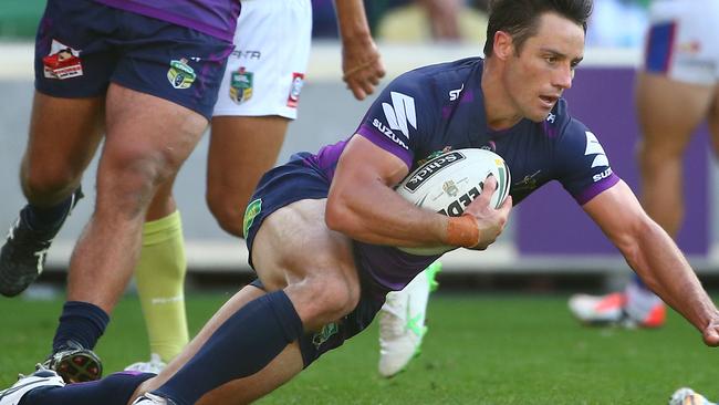 MELBOURNE, AUSTRALIA - APRIL 02: Cooper Cronk of the Storm scores a try during the round five NRL match between the Melbourne Storm and the Newcastle Knights at AAMI Park on April 2, 2016 in Melbourne, Australia. (Photo by Scott Barbour/Getty Images)