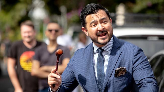 Sydney auctioneer Ben Hanly brings down the gavel at the auction of 196 Union Street, Erskineville, Sydney on Saturday. Picture: Julian Andrews.