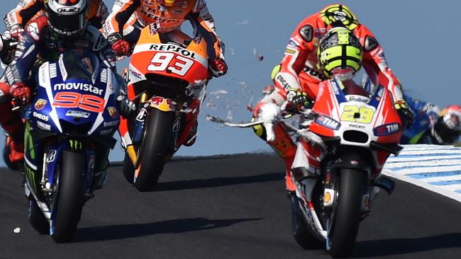 Andrea Iannone of Italy ducks as a seagull smashes into his bike. Picture: AFP.