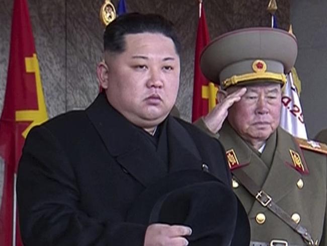 In this image made from video by North Korea's KRT, North Korean leader Kim Jong Un, center, attends a military parade in Pyongyang, North Korea Thursday, Feb. 8, 2018. North Korea held the military parade and rally on Kim Il Sung Square on Thursday, just one day before South Korea hosts the opening ceremony of the Pyeongchang Winter Olympics. (KRT via AP Video)