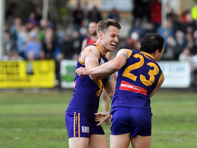 Ryan Mullett celebrates a goal with Alex Greenwood. Picture: James Ross/AAP