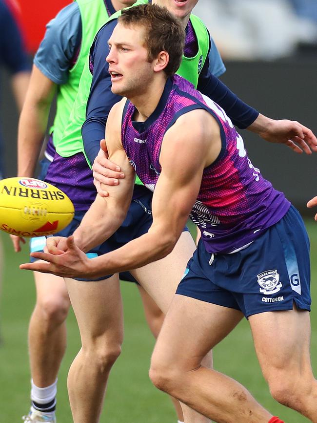 Tom Atkins fires a handball. Picture: Alison Wynd