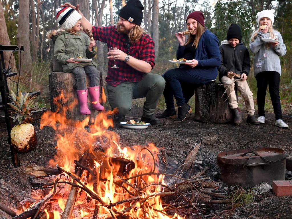 Source SA Cover - Cooking on a camp fire with Shannon Fleming at Ashton. Shannon with wife Nicole and kids Ciara 5, Amelia 8 and Eamon 7. Picture: Tricia Watkinson