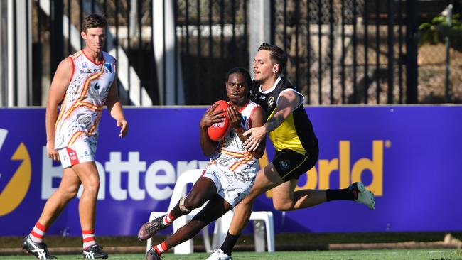 Cheyne Miles makes a tackle on Waratah’s Timothy Kerinaiua in the CAFL rep game. Picture: Pema Tamang Pakhrin