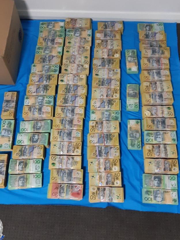 Cash allegedly seized by police.