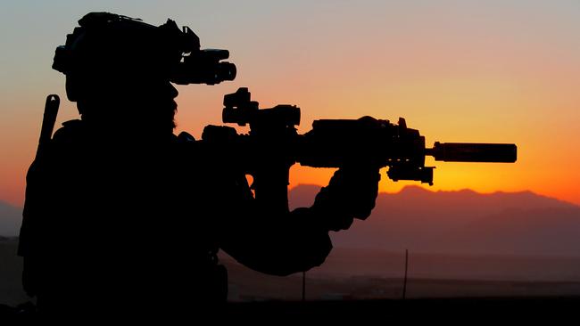 An Australian Army soldier from Special Operations Task Group prepares for a night mission with the Afghan National Security Force's Special Response Team in Uruzgan province, Afghanistan, in October 2010. Picture: Department of Defence