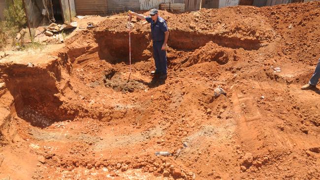 Police search for evidence in the backyard of a Terowie house in October 2013. Picture: SAPOL