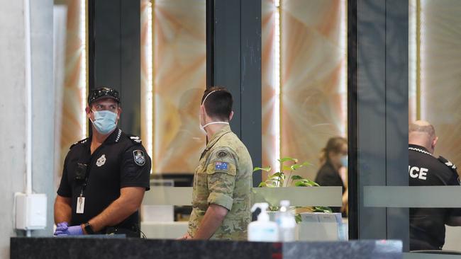 Police, protective services and military monitor the hotel quarantine process at the Westin in Brisbane City. Picture: Annette Dew