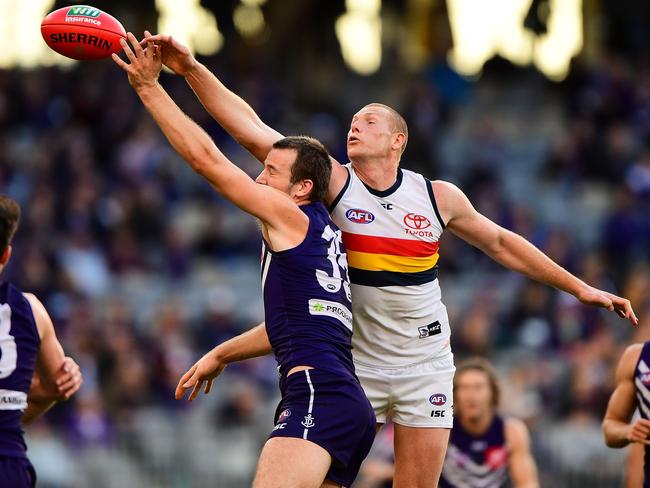 PERTH, AUSTRALIA - JUNE 10: Michael Apeness of the Dockers contests a boundary throw in against Sam Jacobs of the Crows during the 2018 AFL round 12 match between the Fremantle Dockers and the Adelaide Crows at Optus Stadium on June 10, 2018 in Perth, Australia. (Photo by Daniel Carson/AFL Media/Getty Images)