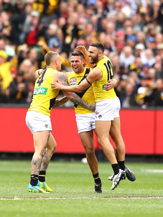 Shane Edwards (right) celebrates with Dustin Martin and Jack Graham. Picture: Mark Kolbe/AFL Media/Getty Images