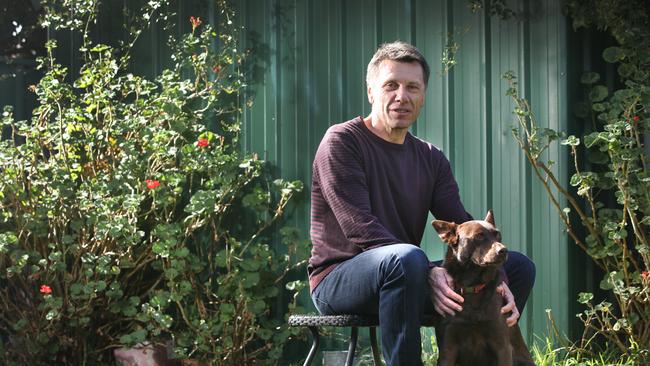 Paul Starick at home with his dog, Rusty, on Monday. His family were involved in a crash with an alleged killer driver over the weekend. Picture: Dean Martin